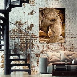 «Профиль слона» в интерьере двухярусной гостиной в стиле лофт с кирпичной стеной