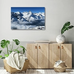 «Деревушка у подножья снежных гор» в интерьере современной комнаты над комодом