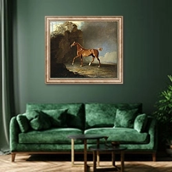 «A Golden Chestnut Racehorse by a Rock Formation, 1800» в интерьере зеленой гостиной над диваном