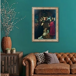 «Рождение Христа» в интерьере гостиной с зеленой стеной над диваном