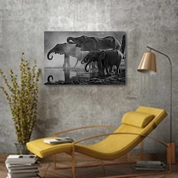 «Слоны со слонятами на водопое» в интерьере в стиле лофт с желтым креслом