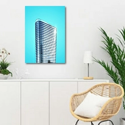 «Современное офисное здание на ярко-голубом небе» в интерьере гостиной в скандинавском стиле над комодом