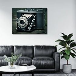 «Винтажная фотокамера» в интерьере офиса в зоне отдыха над диваном