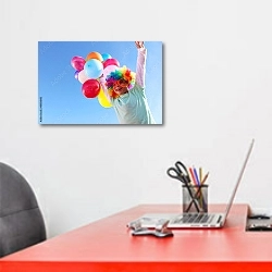 «Мальчик с шариками в разноцветном парике» в интерьере офиса над рабочим местом сотрудника