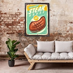 «Стейк хауз, ретро плакат» в интерьере гостиной в стиле лофт над диваном