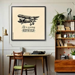 «Винтажный самолет с надписью Life is a journey, enjoy the flight. » в интерьере кабинета в стиле ретро над столом