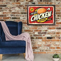 «Ретро постер с жареной курицей» в интерьере в стиле лофт с кирпичной стеной и синим креслом