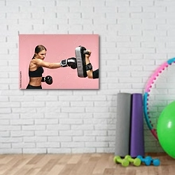 «Девушка боксер в перчатках на розовом фоне» в интерьере фитнес-зала с кирпичной стеной
