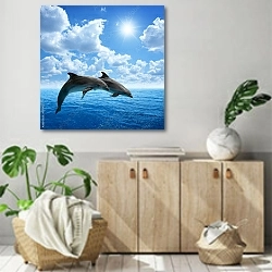 «Два дельфина в синем море» в интерьере современной комнаты над комодом