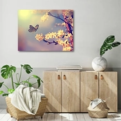 «бабочка, садящаяся на цветущую вишню» в интерьере современной комнаты над комодом
