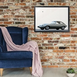 «Jaguar E-Type Coupe (Series II) '1968–71» в интерьере в стиле лофт с кирпичной стеной и синим креслом