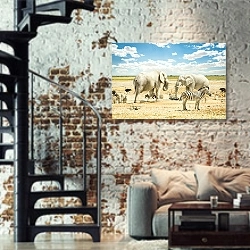 «Группа африканских животных на водопое» в интерьере двухярусной гостиной в стиле лофт с кирпичной стеной