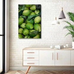 «Зеленые лимоны» в интерьере комнаты в скандинавском стиле над тумбой