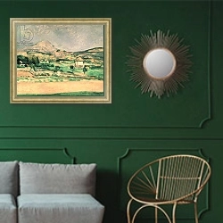 «Montagne Sainte-Victoire, c.1882-85» в интерьере классической гостиной с зеленой стеной над диваном