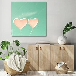«Розовые воздушные шары в форме сердца» в интерьере современной комнаты над комодом