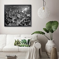 «История в черно-белых фото 365» в интерьере светлой гостиной в скандинавском стиле над диваном