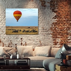 «Воздушный шар над стадом зебр в прерии» в интерьере гостиной в стиле лофт с кирпичной стеной