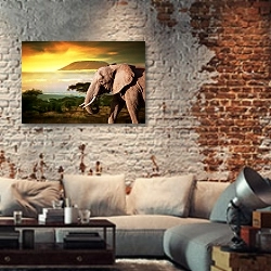 «Слон на фоне Килиманджаро на закате» в интерьере гостиной в стиле лофт с кирпичной стеной