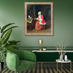 «Рисующая молодая женщина» в интерьере гостиной в зеленых тонах