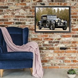«Bentley 4 Litre Coupe by Mulliner '1931» в интерьере в стиле лофт с кирпичной стеной и синим креслом