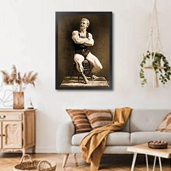«Eugen Sandow, in classical ancient Greco-Roman pose, c.1893» в интерьере гостиной в стиле ретро над диваном