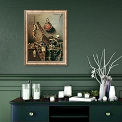 «Orientalischer Hausrat» в интерьере прихожей в зеленых тонах над комодом