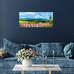 «Цветущее поле на фоне гор» в интерьере стильной синей гостиной над диваном