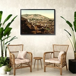 «Грузия. Тифлис, вид с крепостной дороги» в интерьере комнаты в стиле ретро с плетеными креслами
