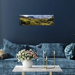 «Поросшие мхом камни на закате, Исландия» в интерьере стильной синей гостиной над диваном