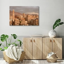 «Историческая часть Саны - столицы Йемена вечером» в интерьере современной комнаты над комодом