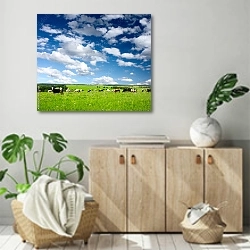 «Коровы на лугу» в интерьере современной комнаты над комодом