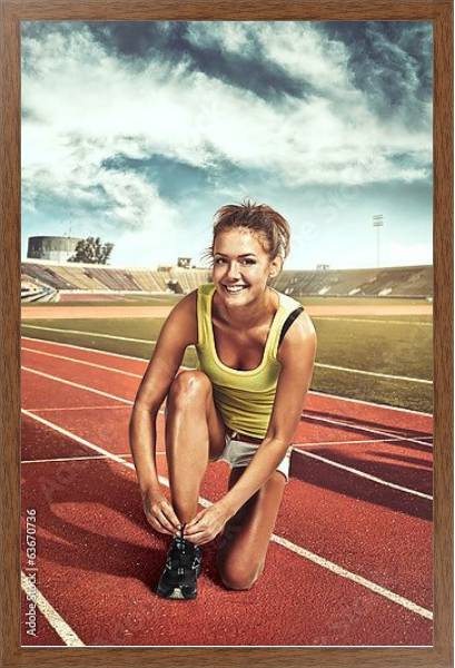 Постер Девушка перед пробежкой на стадионе с типом исполнения На холсте в раме в багетной раме 1727.4310