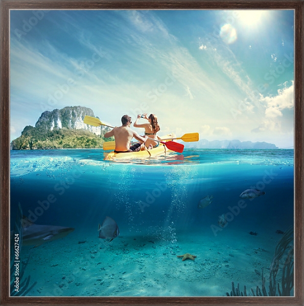 Постер Молодая пара на каяке у тропического острова с типом исполнения На холсте в раме в багетной раме 221-02