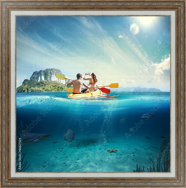 Постер Молодая пара на каяке у тропического острова с типом исполнения На холсте в раме в багетной раме 595.M52.330