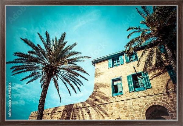Постер Дом с пальмами в Яффо, на юге старой части Тель-Авива, Израиль с типом исполнения На холсте в раме в багетной раме 221-02