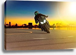 Постер man riding sport motorcycle leaning in sharp curve with travelin