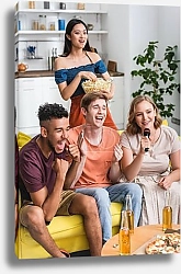 Постер excited multiethnic friends applauding while singing karaoke during party
