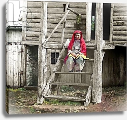 Постер Bashkir woman in a folk costume sitting on the stairs of her wooden house, Ural Mountains, Russian Empire, 1910