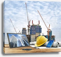Постер Blueprints and safety helmet over a table in construction site