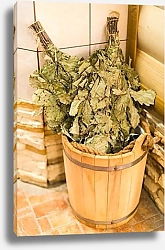 Постер Bath accessories in traditional Russian sauna. Bath brooms from oak in wooden sauna bucket in the russian bath close up.