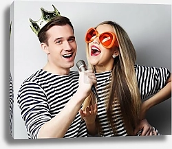 Постер beautiful young loving couple ready for party.