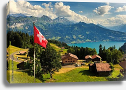 Постер Швейцария. View of Interlaken with Swiss flag Постер Швейцария. View of Interlaken with Swiss flag