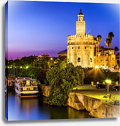 Постер Испания. Севилья. Золотая башня (Torre del Oro) ночью Постер Испания. Севилья. Золотая башня (Torre del Oro) ночью