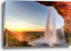 Постер Исландия. Seljalandsfoss Waterfall at sunset Постер Исландия. Seljalandsfoss Waterfall at sunset