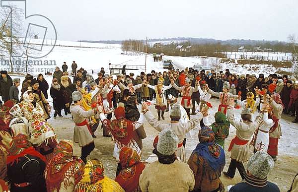 A folk dance ensemble performing a traditional Christmas Eve winter round dance at the Poltavshchina Museum Reserve in Russia