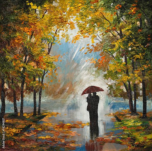 Влюбленная пара под дождем в осеннем парке