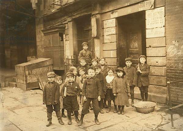 Children outside motion picture theatre at night, 1910
