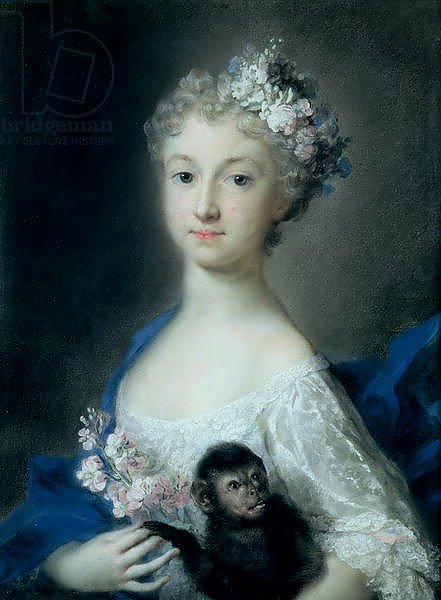 Girl holding a monkey