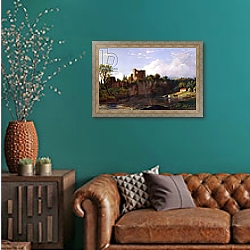 «Chepstow Castle, on the Wye, 1854» в интерьере гостиной с зеленой стеной над диваном «Chepstow Castle, on the Wye, 1854» в интерьере гостиной с зеленой стеной над диваном