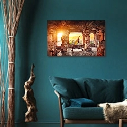 «Йога в храме Хампи» в интерьере зеленой гостиной в этническом стиле над диваном